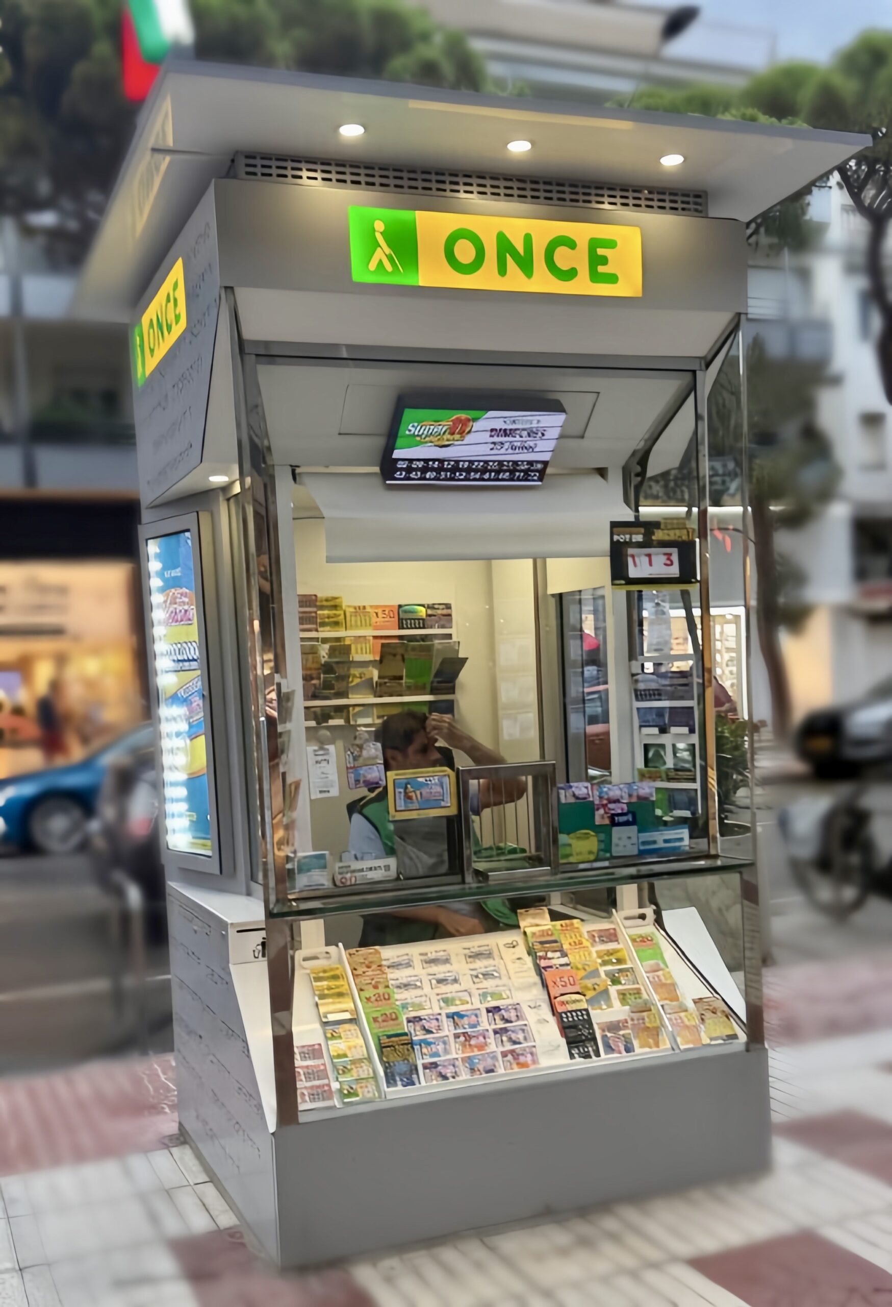 ONCE lottery kiosk on a street in Spain, displaying lottery tickets for sale